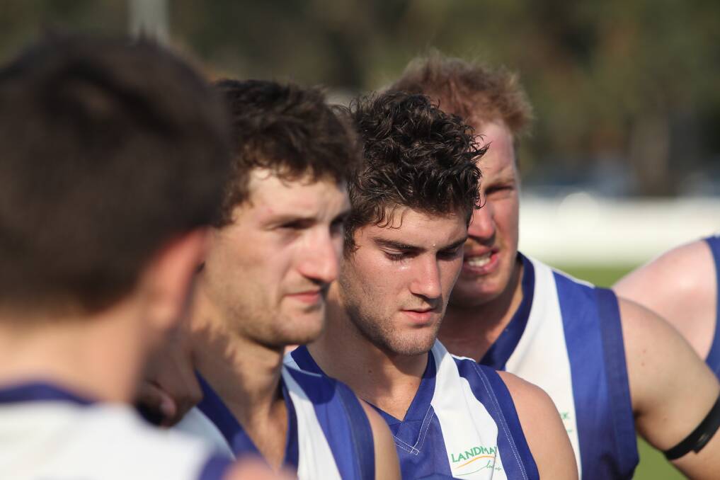 DISCUSSIONS: Star-player for Kaniva-Leeor United Josh La Rocca listening to the quarter-time talk being made by player-coach Nick Murphy, with his brother Chris La Rocca and Chris Meyer. Picture: KANIVA-LEEOR UNITED