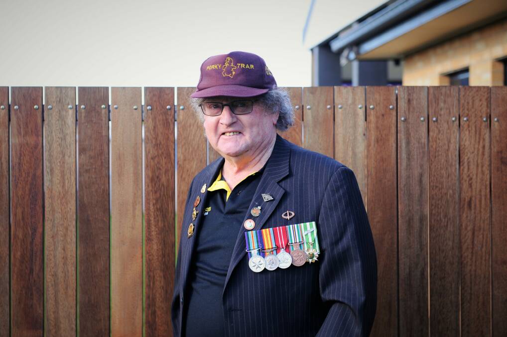 SERVICE: John Finn with his Australian Active Service, Victorian Campaign, Australian Defence, Anniversary of National Services and South Vietnam medals from his time serving Australia. Picture: ELIJAH MACCHIA