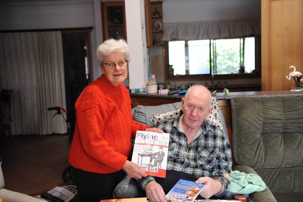 REMEMBERED: Julet and Graham Schultz with books about revolutionary Glenlee-born inventor of the pedal wireless, Alfred Hermann Traeger. Picture: ELIJAH MACCHIA 