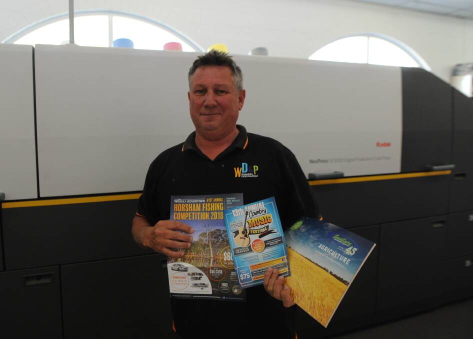 Business boost: Wimmera Design and Print director Chris O'Connor said the business printed material for Horsham Fishing Competition, Horsham Country Music Festival and Wimmera Machinery Field Days. Picture: ELIZA BERLAGE