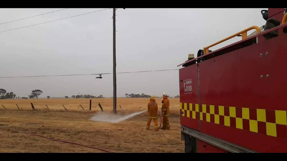 POWERLINE FIRE: Country Fire Authority firefighters work to control the powerline fire at Quantong on Friday. Picture: LEN HAWKER