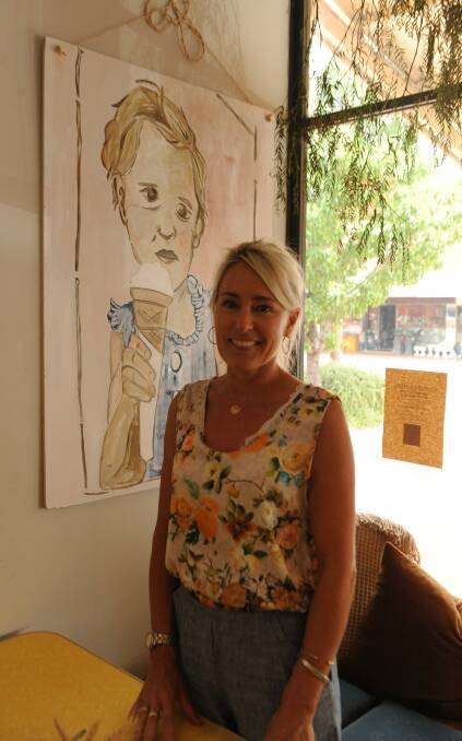 ARTY EYE: Alex O'Halloran with a work she painted which hangs in the Dimboola General Store. Picture: ELIZA BERLAGE