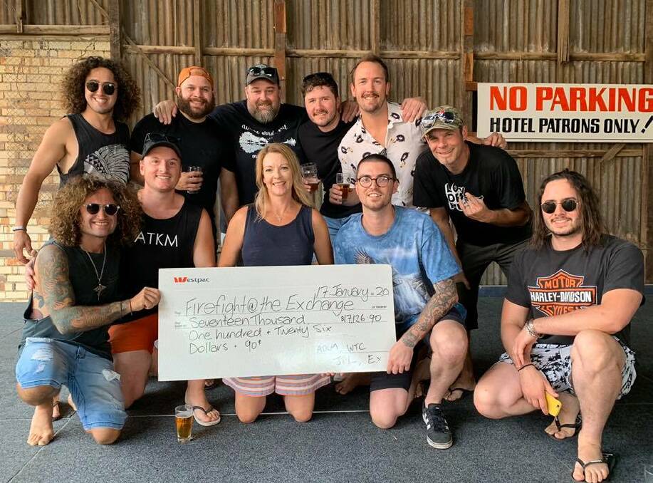 BIG NIGHT: Band members from All The Kings Men, Johnny Thunder and The Lightnings and White Trash Candy with a cheque from the bushfire relief gig they played at Horsham's Exchange Hotel on Friday night. Picture: CONTRIBUTED