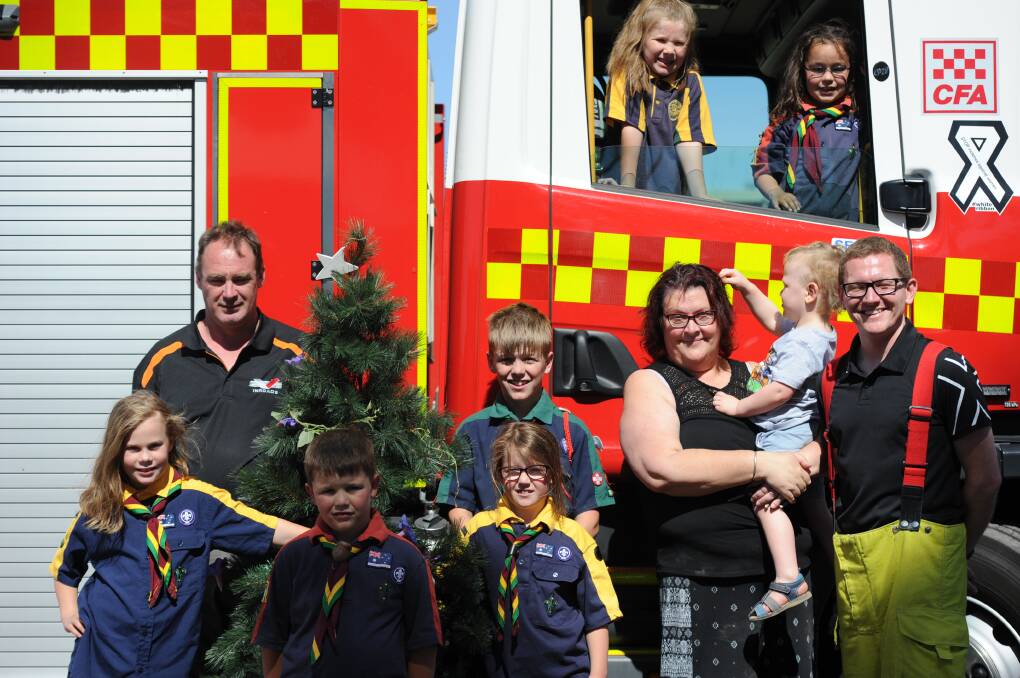 FAMILY FUN: CFA District 17's John St Clair, 10-year-old Ruby Brasher, six-year-old Eli McLean, eight-year-old Zahlee McLean, 13-year-old Kaydn McLean, Cindy Hammond with two-year-old Jaxon Hammond-O'Connor, CFA District 17's Marc Ampt, seven-year-old Charidy McKinley and seven-year-old Zoe Monteau. Picture: ELIZA BERLAGE