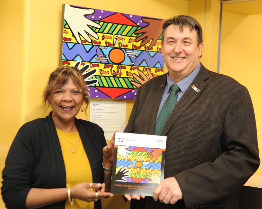 COMMITTED: Wotjobaluk woman Joanne Harrison-Clarke and Federation University head of campus Geoffrey Lord with the reconciliation plan. Picture: ELIZA BERLAGE 