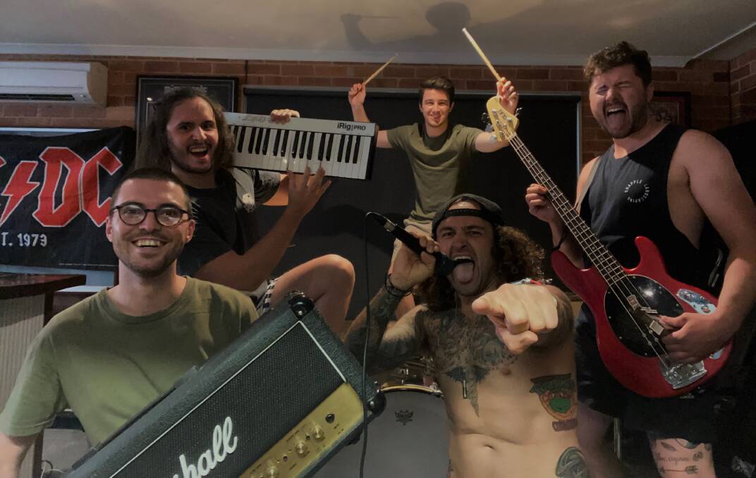 ROCK READY: Nic Campesato, Tony Block, Sean Wales, Josh Young and Mark Block from White Trash Candy rehearse ahead of the bushfire appeal gig on Friday. Picture: CONTRIBUTED