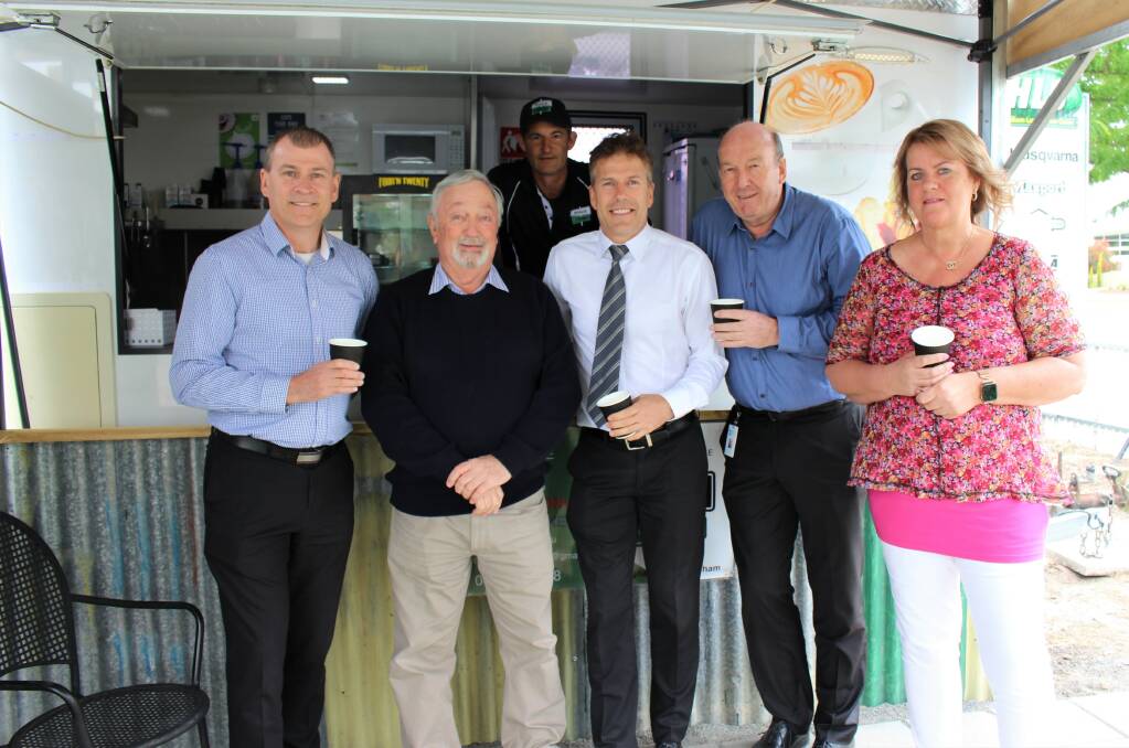 COFFEE TIME: Richard Goudie, Graeme Hardman, Robert Goudie, Peter Miller and Christine Chapple. The vans new owner Brad Wade is inside. Picture: CONTRIBUTED