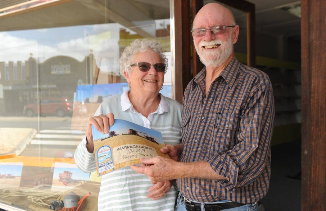 PASSION PROJECT: Eileen Sholl and Walter Sholl with a copy of Mr Sholl's book 'Warracknabeal: The 2019 Passing Parade' outside the exhibition space on Scott Street. Pictures: ELIZA BERLAGE