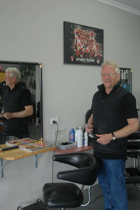 INDUSTRY STALWART: Peter Wood in his Pebees hairdressing salon in Horsham, still enjoying cutting hair after 48 years.
