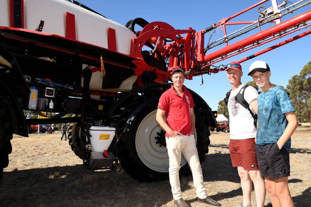 Agrifac's James Fox with Dimboola's Ceus Wolthuis and his son Tonnis at the Wimmera Machinery Field Days. Picture: SAMANTHA CAMARRI