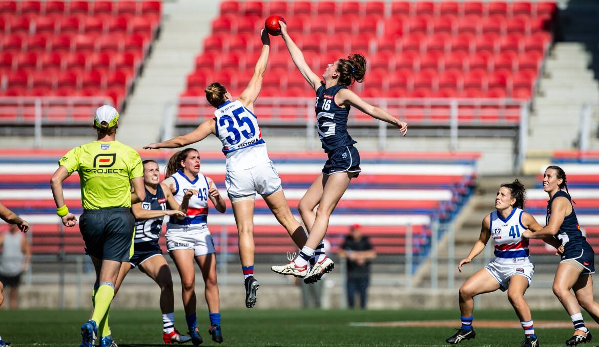 Rene Caris, right, rucks during a practice match for the Geelong Cats before her debut in the AFLW competition. Picture: ARJ GIESE