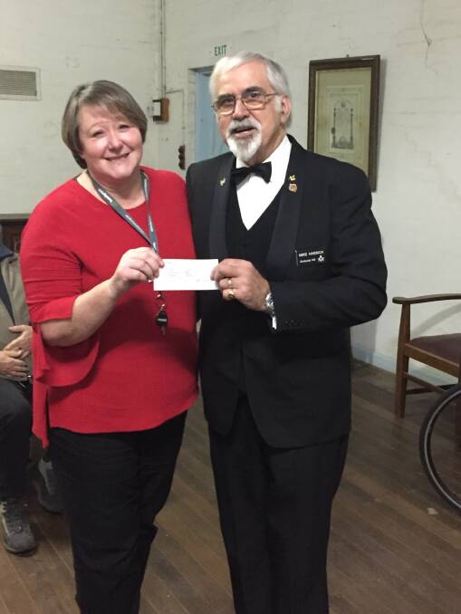Dimboola Masonic Lodge 144 Worshipful Master Mick Haebich presents a cheque to headspace Horsham manager Liz Rowe. Picture: CONTRIBUTED