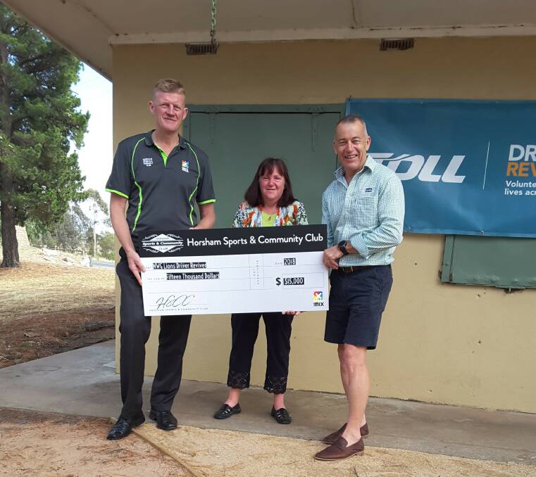 Horsham Sports and Community Club manager Glenn Carroll and club president Gary Howden present a cheque for $15,000 to Green Lake Kiosk manager Leonie Lawson. Picture: CONTRIBUTED