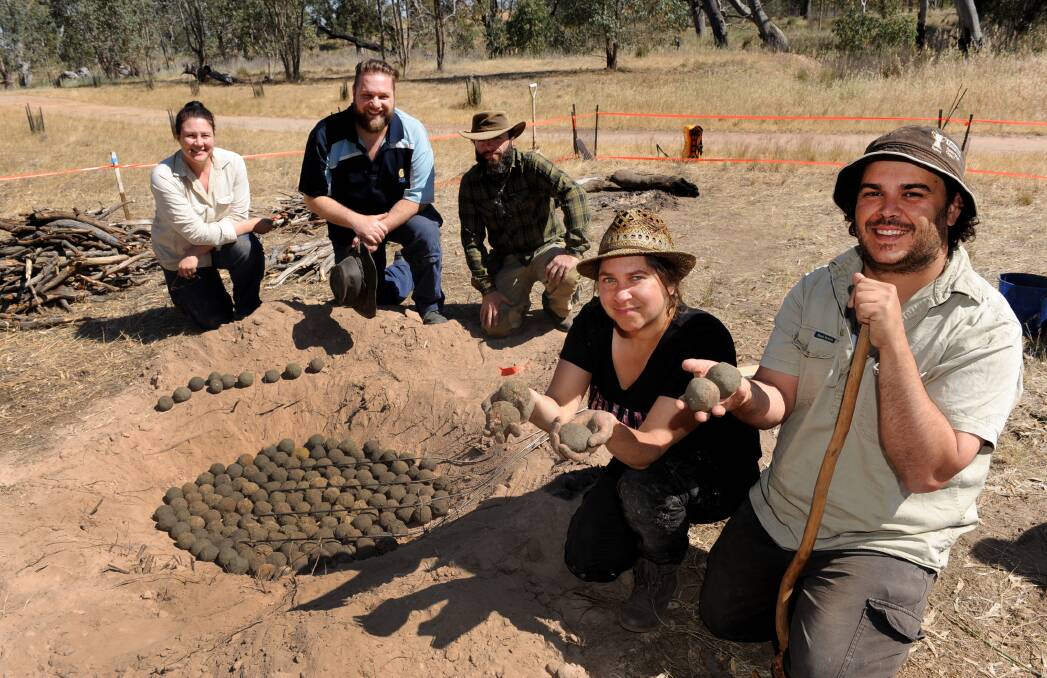UNEARTHED: Abby Cooper, Darren Griffin, Maurizio Campanelli, Tracey Rigney and Daniel Clarke recreate an earth oven in Horsham. Picture: SAMANTHA CAMARRI