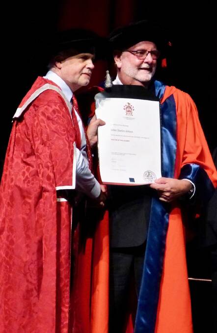 Dr Aitken receives his PhD.