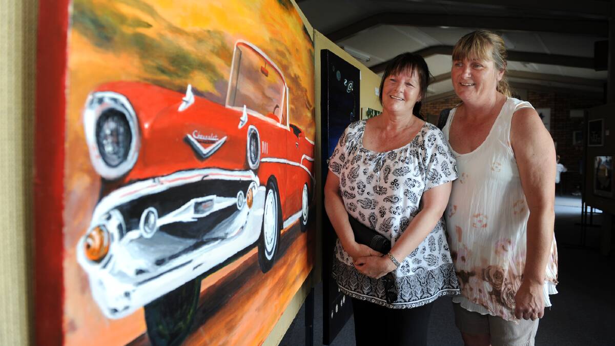 Keren Loats and Cindy Marsh admire artwork at the 2015 Minyip Show.