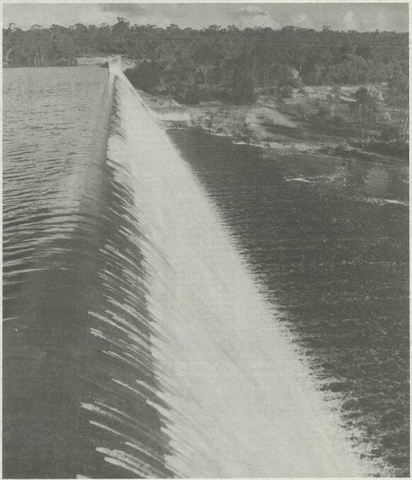 Water spilling over Rocklands Reservoir spillway flows into the Glenelg River after a wet winter in 1988. The reservoir level is now almost two metres below the spillway. 