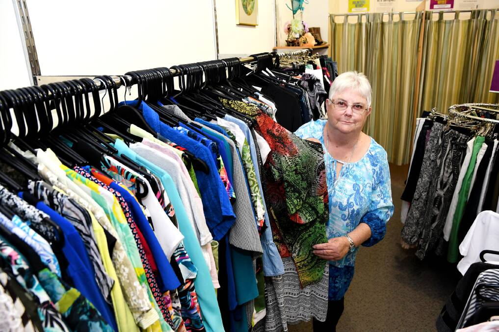DONATIONS: Horsham's Red Cross International's Lynne McCann with clothes donated to the opportunity store. Picture: SAMANTHA CAMARRI
