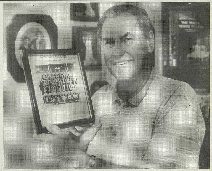 REMEMBER WHEN: Max Woodward is pictured with a photo of the Warracknabeal Football Club premiership team of 1966. 