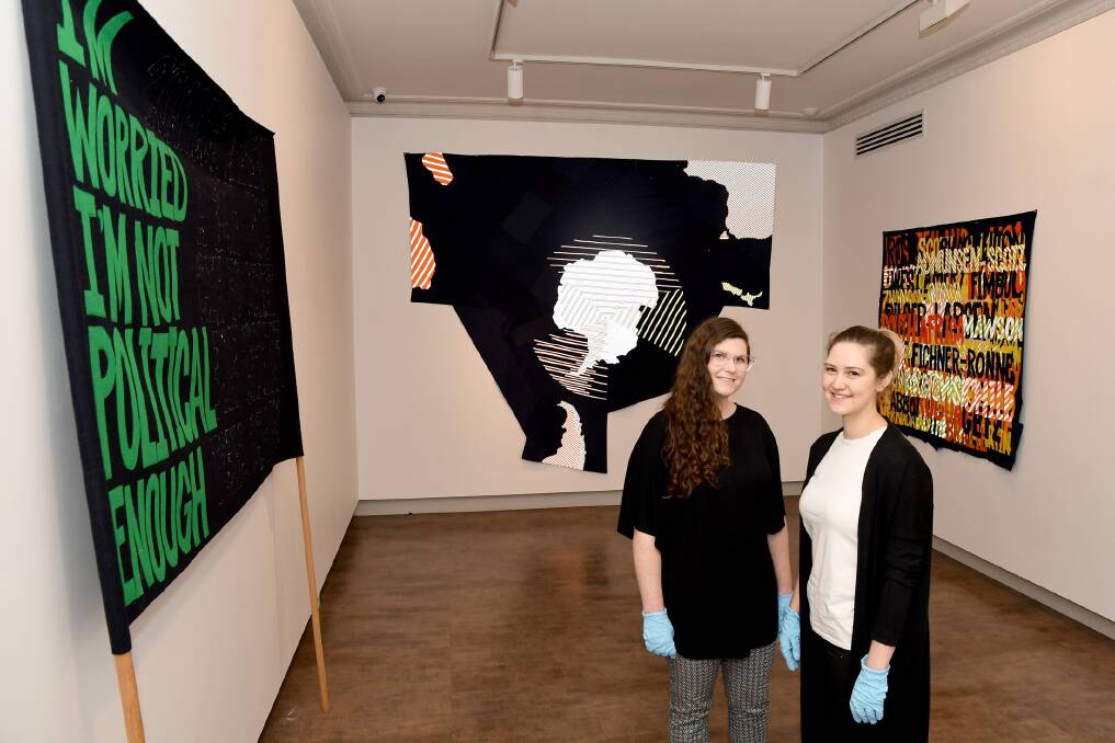 THOUGHT-PROVOKING ART: Horsham Regional Art Gallery curator Michelle Mountain and exhibition co-ordinator Ellen Wignell, with Raquel Ormella's new exhibition. Picture: SAMANTHA CAMARRI