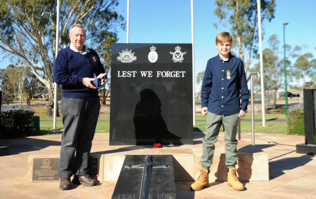 REMEMBERING FAMILY: Ray Harris and great-grandson Beau Ryan with Navy service medals belonging to Beau's mother Rachel. The pair will take part in the Horsham Anzac Day march on Thursday. Picture: ALEXANDER DARLING