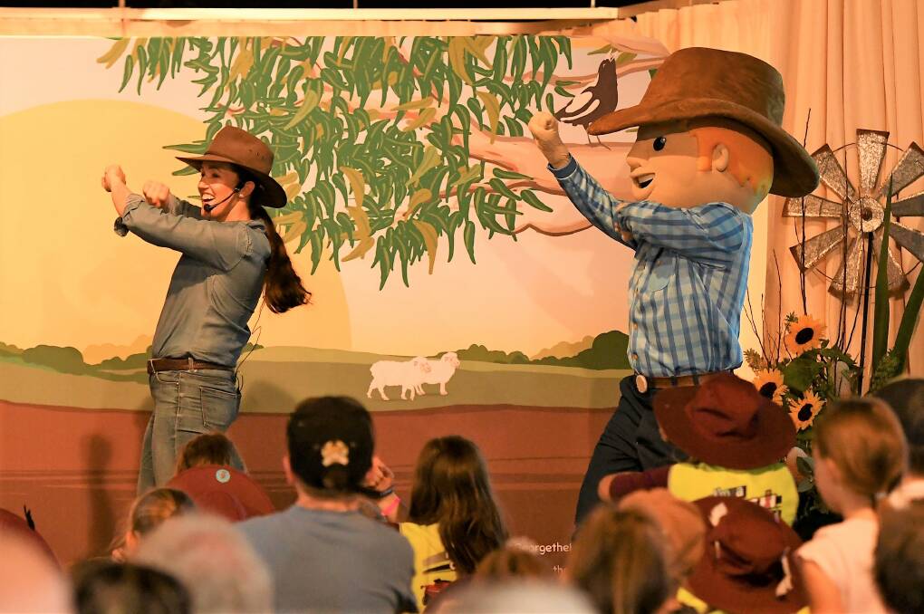 LOTS OF FUN: Simone Kain with George the Farmer performing at the Wimmera Machinery Field Days in 2018. George will be back again for the 2019 event. Picture: SAMANTHA CAMARRI