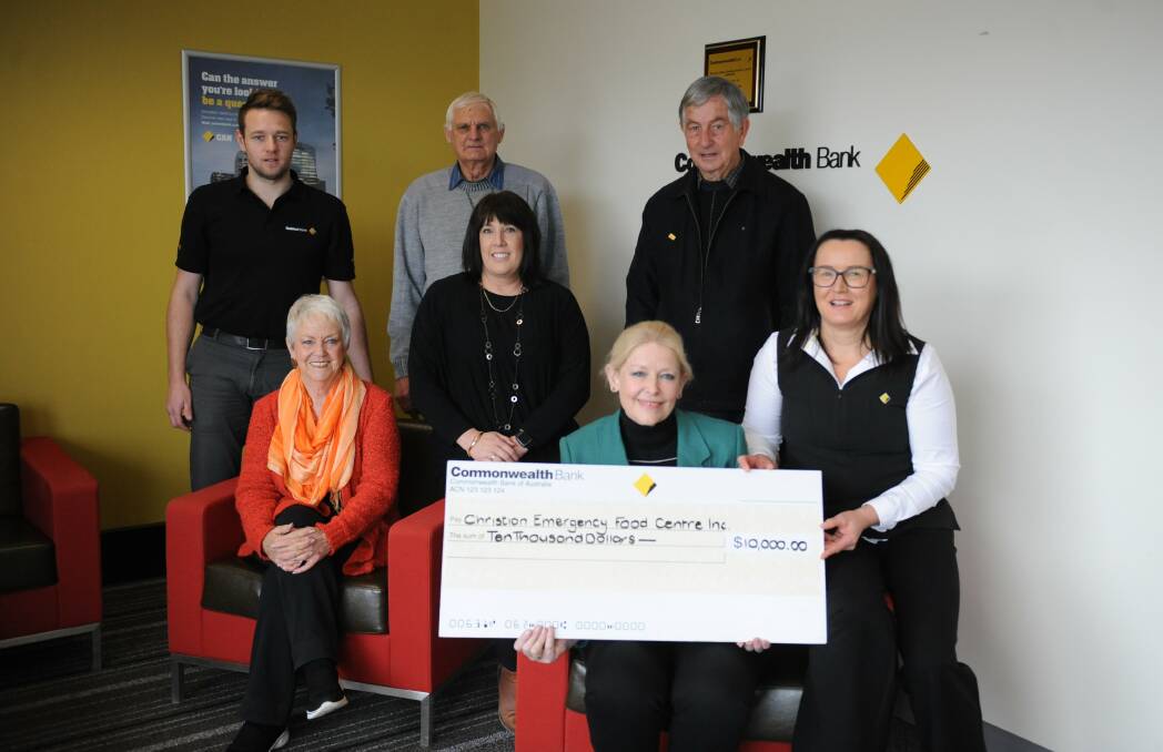 Commonwealth Bank Regional Agribusiness Centre Horsham employees Marc Thomas, Vivian Hiscock and Tracey Taylor, and Horsham Christian Emergency Food Centre volunteers Anne Mahony, Les Warrick, Ian Walter and Bev Miatke, with a $10,000 donation for the centre. Picture: JADE BATE