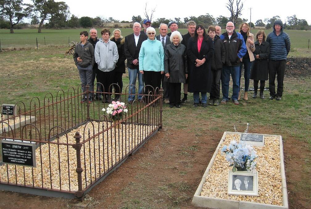 Descendants of Toolondo's George and Annie Smith at the couple's new burial site in the Clear Lake Cemetery, next to the grave of their daughters Betty and Phyllis. Picture: CONTRIBUTED