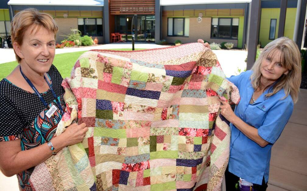  Yarriambiack Lodge manager Wendy Walters and nurse Mandy Osborne with a patchwork quilt donated to lodge residents in 2016.