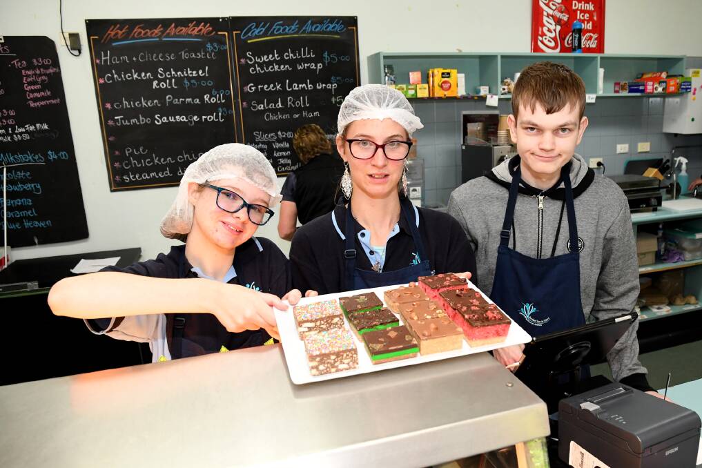 SKILLS: Horsham Special School students Abby Dumesny-Huf, Holly Tucker, and Cayde McAlpine, running the cafe at Federation Uni. Picture: SAMANTHA CAMARRI
