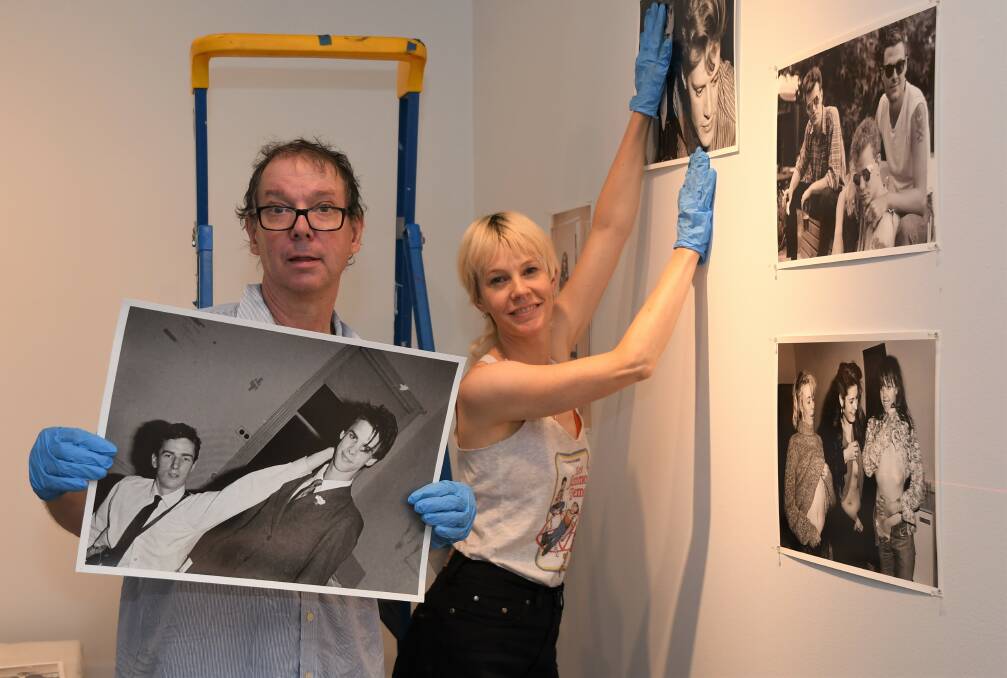 NEW SHOW: Photographer Peter Milne and exhibition curator Linsey Gosper hang photos from the Horsham gallery exhibition 'Juvenilia'.
