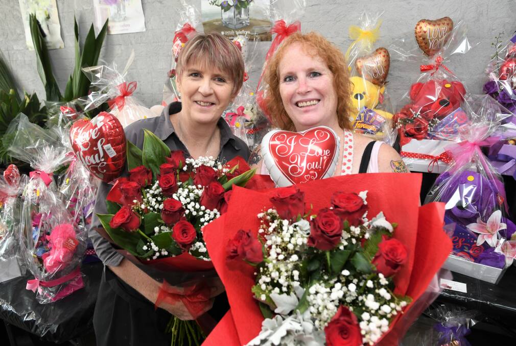 PREPARED: Horsham Florist co-owners Susan McQueen and Rosemary Arnott with arrangements prepared for the shop's busiest day of the year - Valentine's Day. Picture: JADE BATE