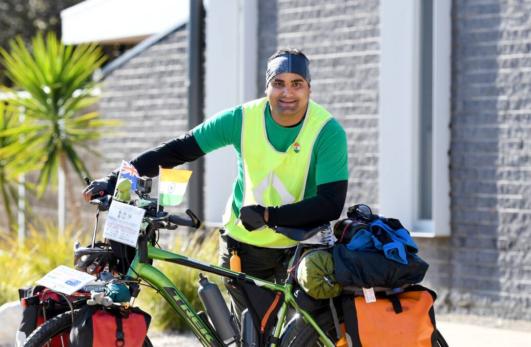 BIG AMBITION: Environmental activist Abhishek Kumar Sharma stopped off in Horsham on Monday as part of his six-year, 90-plus country world tour by bike. Picture: SAMANTHA CAMARRI