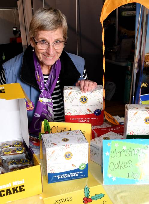 Ann Dent with some of the wares the group was selling at its stall. Picture: SAMANTHA CAMARRI