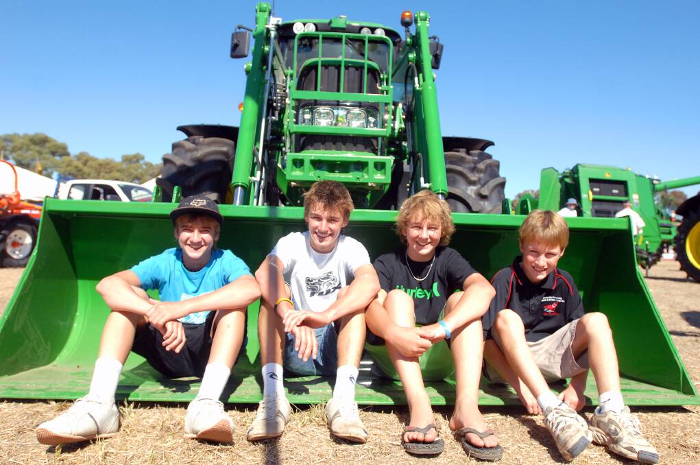 BLAST FROM THE PAST: Horsham's Tom Murray, Jayden Stacey, Todd Richardson, and Riley Stacey sitting in a John Deere tractor at the 2008 Wimmera Machinery Field Days.