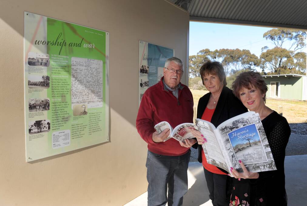 David Eltringham, Sue Exell and Helen Curkpatrick at the Haven memorial following the Black Saturday bushfires.