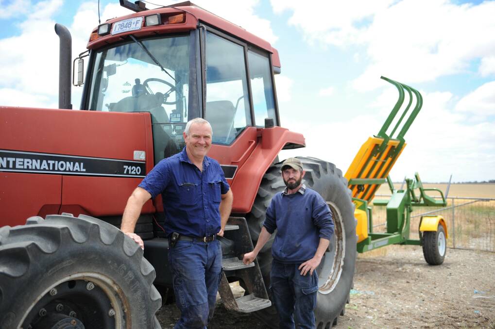 HARVEST IN MOTION: Vectis cropping farmer Vaughn Maroske and farm employee Andrew Schultz at the 800 hectare property. Mr Maroske said they started harvest two weeks ago and were about 40 per cent completed. Picture: JADE BATE