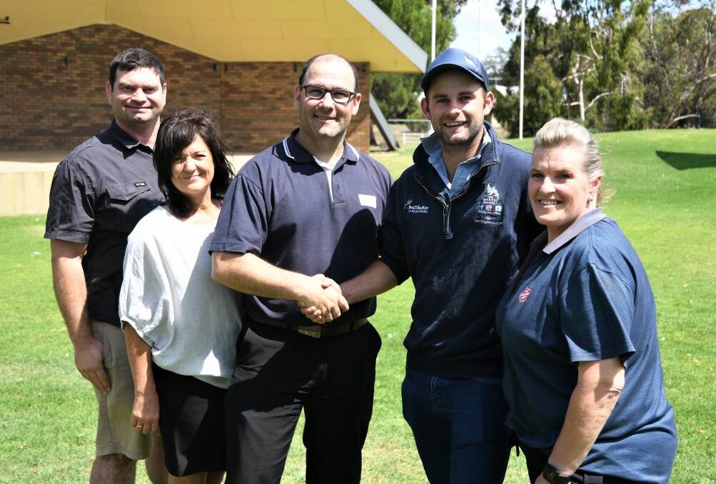 GENEROSITY: The Naked Farmer's Ben Brooksby (second from right) with Horsham Carols by Candlelight committee members Alistair Smith, Pauline Schmidt, Simon Dandy and Raelene Johnston. The committee gave The Naked Farmer a $5000 donation raised during the 2019 Carols by Candlelight at Horsham's Sawyer Park. Picture: JADE BATE