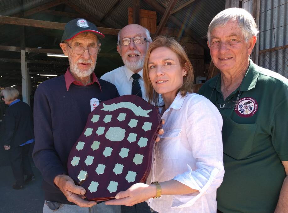 INAUGURAL SHIELD: Alicia McGrath presents the inaugural fleece show award to Nurrabiel wool grower Alan Hutchinson during the Horsham Show. Also pictured are Neville Smith and Ian Walter. Picture: CONTRIBUTED