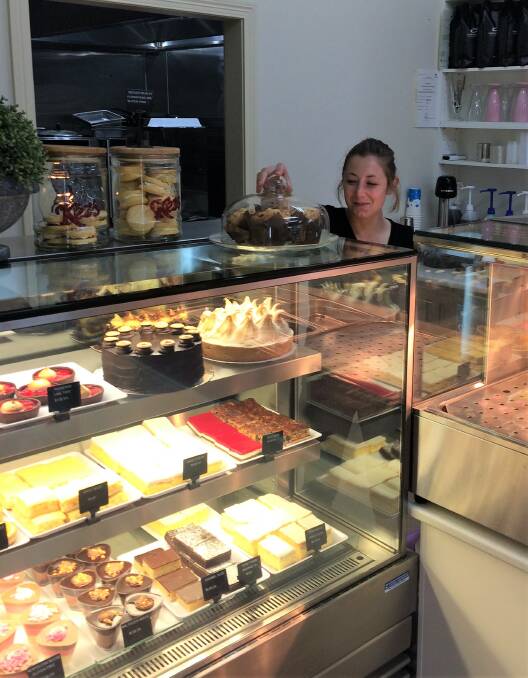 NEW CAFE: Cafe Marma employee Kayla Winters with some of the cakes on display at Murtoa's newest cafe. Picture: CONTRIBUTED