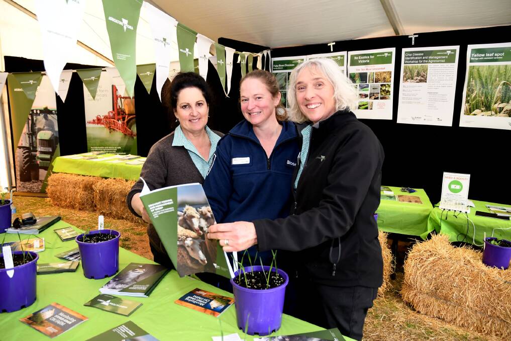 Agriulture Victoria  land management extension officer Heather Drendel, animal health officer Robyn Leishman and northern region grains manager Melissa Cann at Agriculture Victoria's information tent at the Mallee Machinery Field Days at Speed on Tuesday. Picture: SAMANTHA CAMARRI