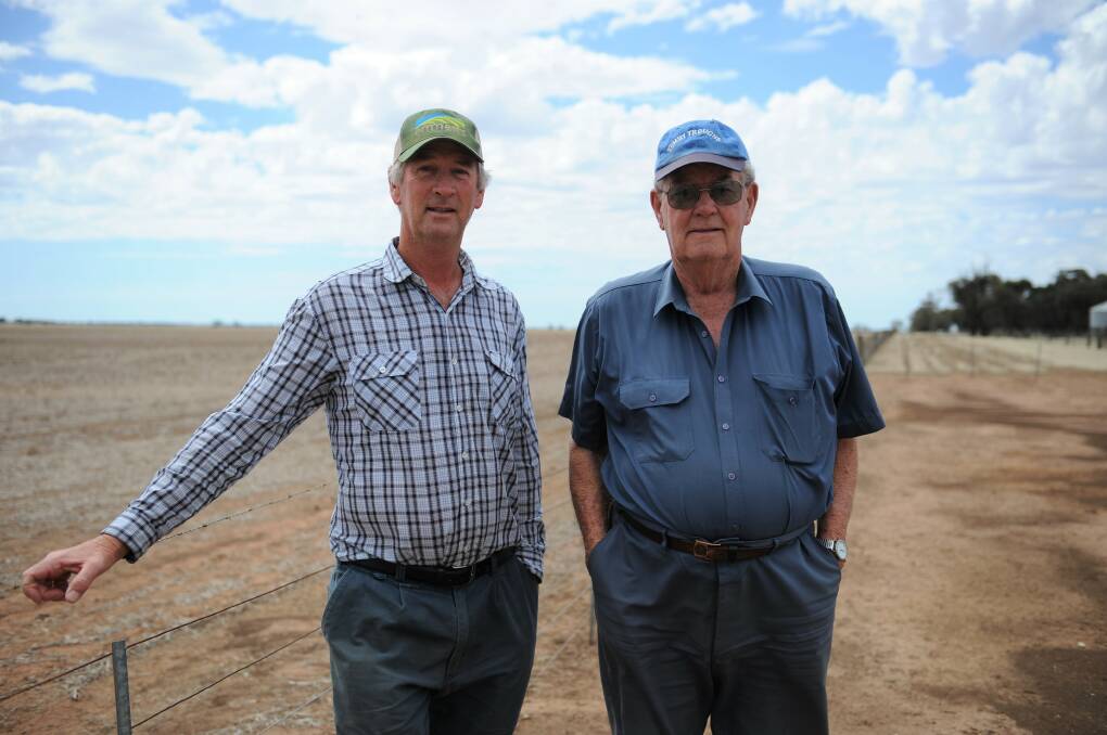 PLANNING FOR FUTURE: Farmer Brendon Bibby with dad Ken Bibby at their 2300-acre Cannum property. The pair has decided to share farm their land. Picture: JADE BATE