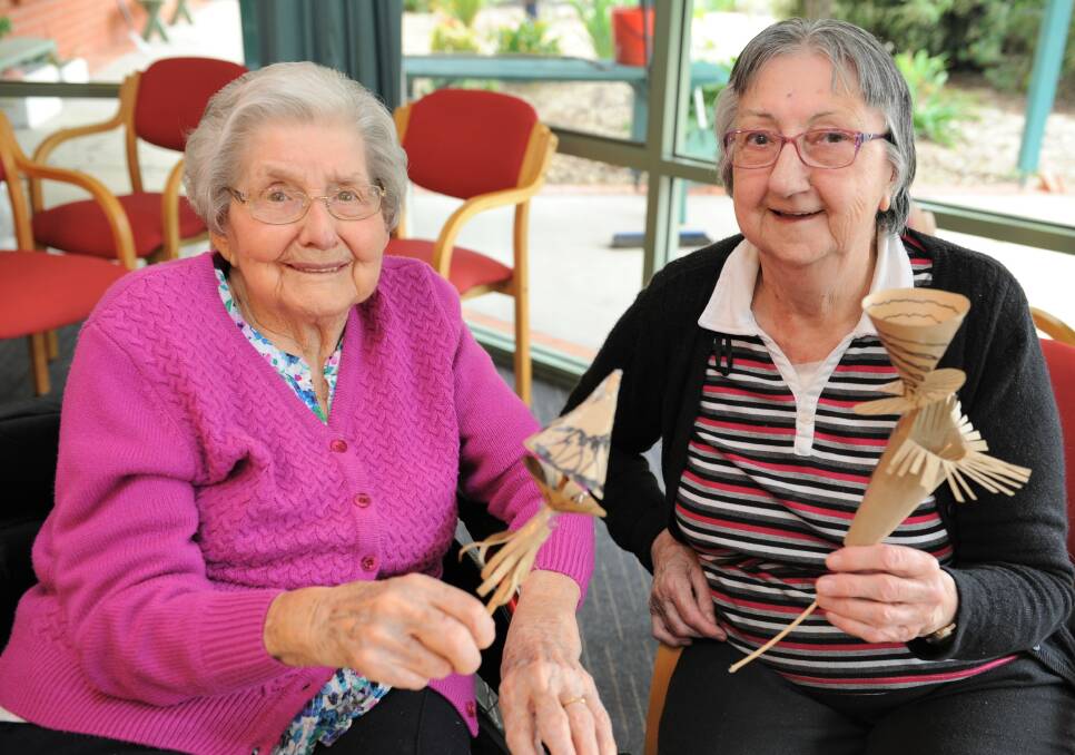 CREATIVE: Natimuk Aged Care residents Jean Lupton an Glenys McCuish with paper flowers created as part of the 2019 Nati Frinj Biennale. Picture: JADE BATE