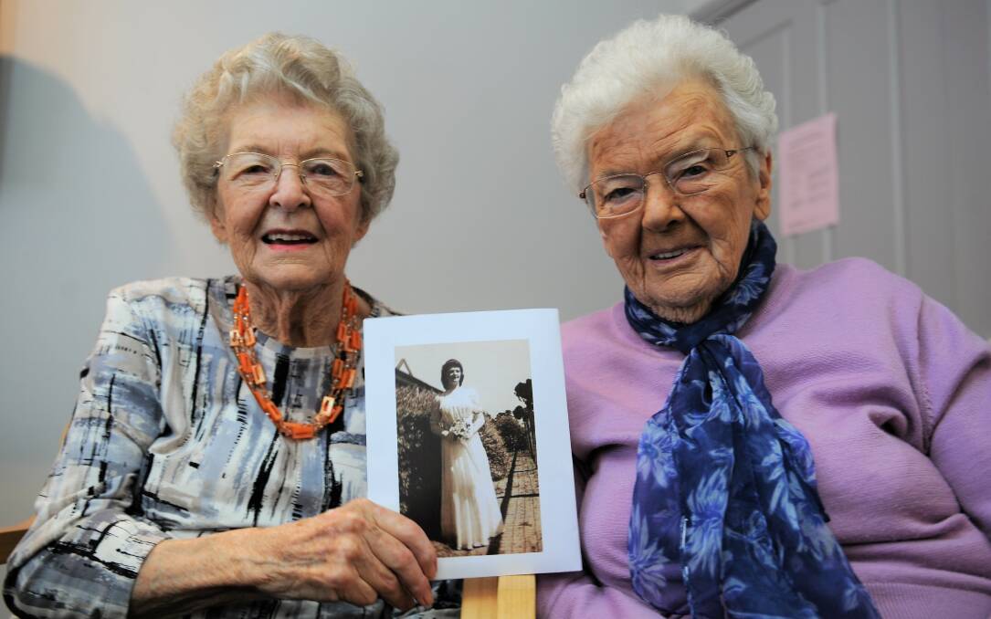 MEMORIES: Horsham's Sunnyside Lutheran Retirement Village residents Ercyl Robertson and Shirley Shipham, both 91, with a photograph from Ercyl's debutante ball when she was 17. Picture: JADE BATE