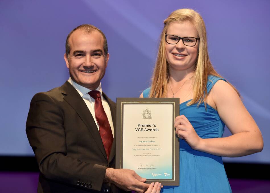 TOP OF THE CLASS: Nhill College 2017 dux Lauren Kerber received her Premier’s Victorian Certificate of Education Award from Deputy Premier and Education Minister James Merlino. Picture: CONTRIBUTED

 