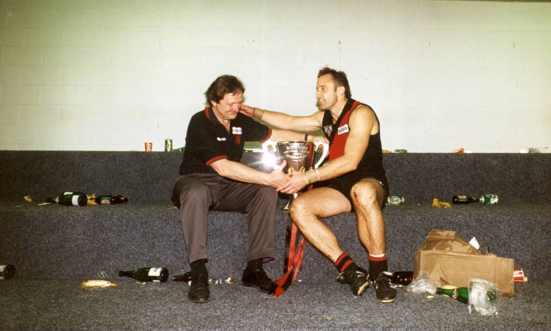 Kevin Sheedy and Tim Watson with the 1993 premiership cup after Essendon's grand final win. Picture: Stuart Hannagan
