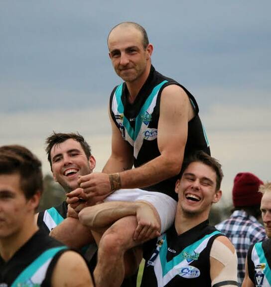 MILESTONE MAN: Nick Pickering being chaired off after his 250th game.
Picture: Trish Ralph