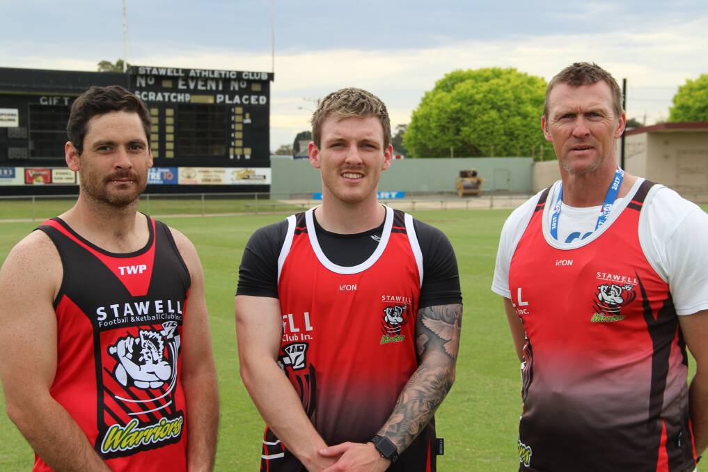 MAKING MOVES: Stawell co-coaches Damian Joiner and Jamie Solyom with new recruit Jay Moody (centre). Moody joins the Warriors from Portland. Picture: LACHLAN WILLIAMS