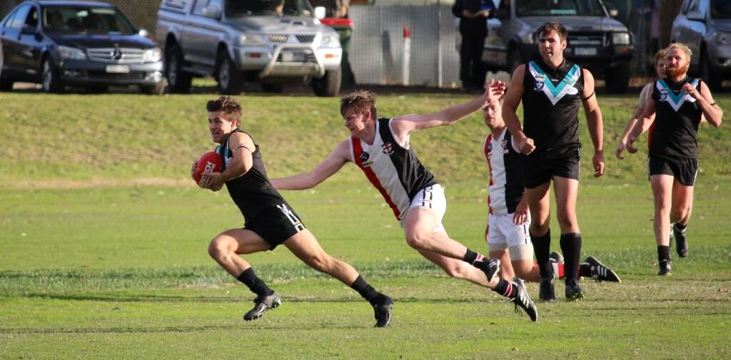 QUICK FEET: Swifts' Ben Taylor avoids a tackle when the Baggies played the Saints in round four. Picture: Trish Ralph. 