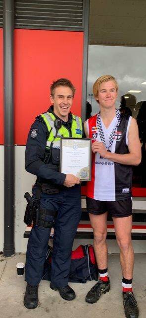 WINNER: Cody Helyar receives his award from Horsham police First Constable Shaun Childs.